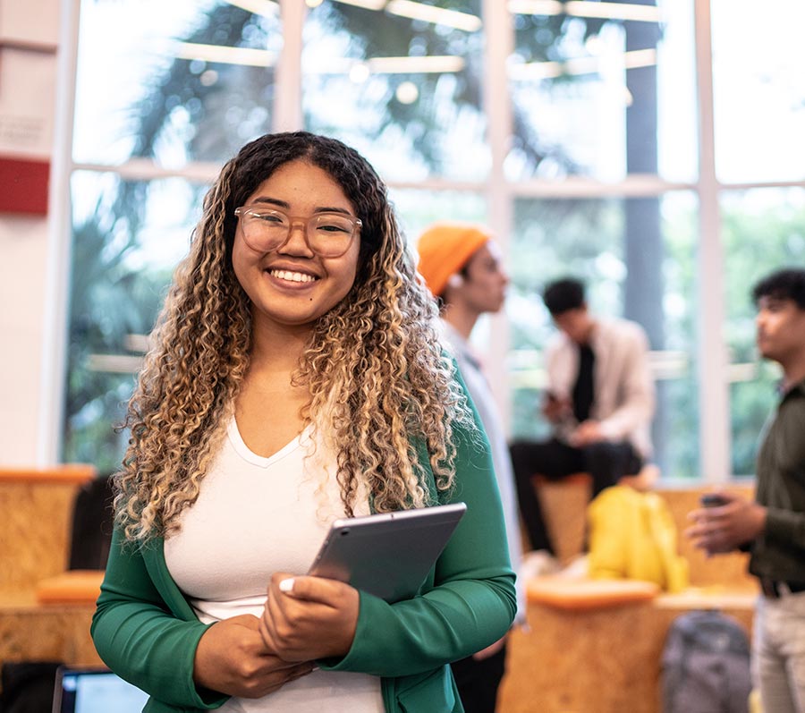 Career Pathways Program Student Smiling Tablet - Pay It Forward 365